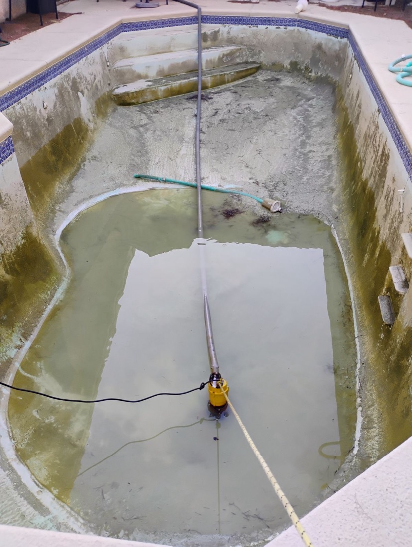 Pool being drained by Excellent Pool Care ahead of an acid wash